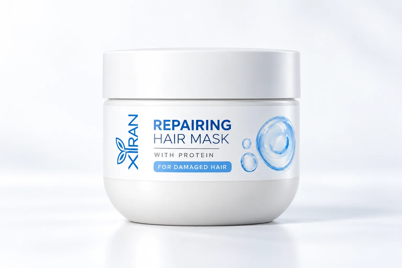 White jar of Xiran repairing hair mask infused with protein, designed for damaged hair, displayed against a white background.